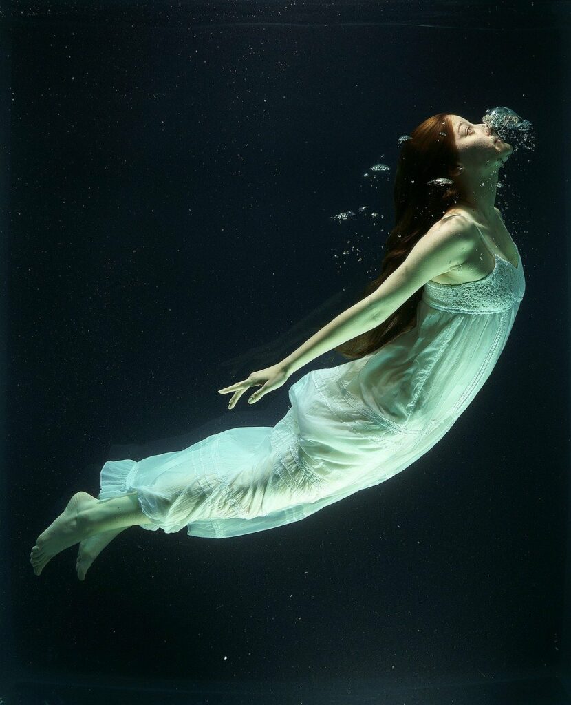 Woman breathing underwater